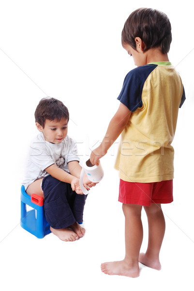 Kid is helping another one on toilet Stock photo © zurijeta