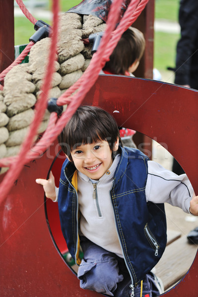 Child playing in park with ropes and climbing Stock photo © zurijeta
