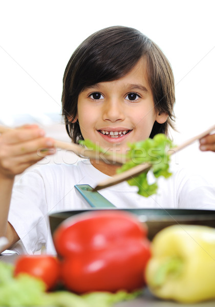 Stock photo: Little boy alone cooking in the kitchen