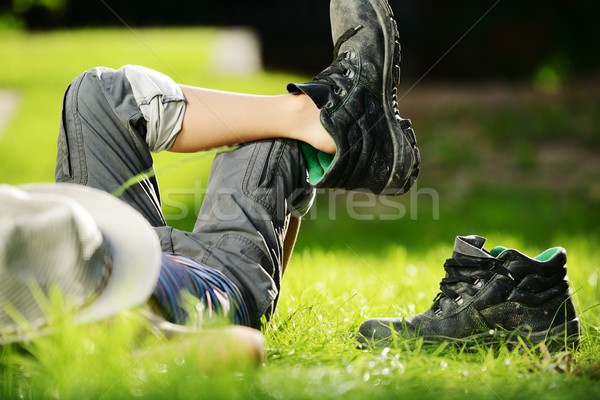 Relaxed child resting on summer park grass meadow Stock photo © zurijeta