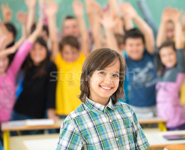 Happy children group with arms outstretched in school classroom Stock photo © zurijeta