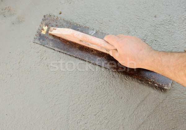 Concrete leveling, worker's hand Stock photo © zurijeta