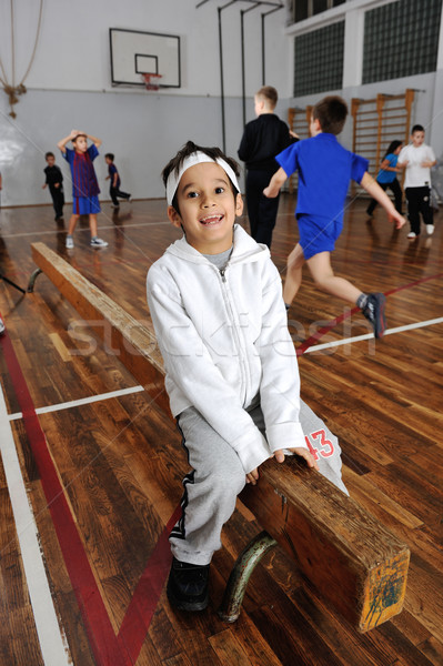 Group of lovely kids doing gymnastics in gym hall Stock photo © zurijeta
