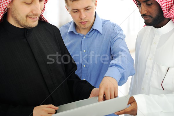 A business team of three planning work in office Stock photo © zurijeta