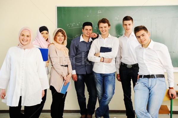 Casual group of students looking happy and smiling Stock photo © zurijeta