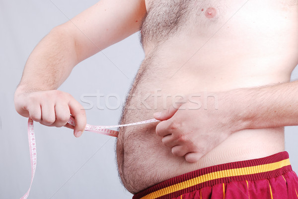 Measuring of stomach, diet is in action Stock photo © zurijeta