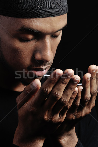 Muslim guy praying Stock photo © zurijeta