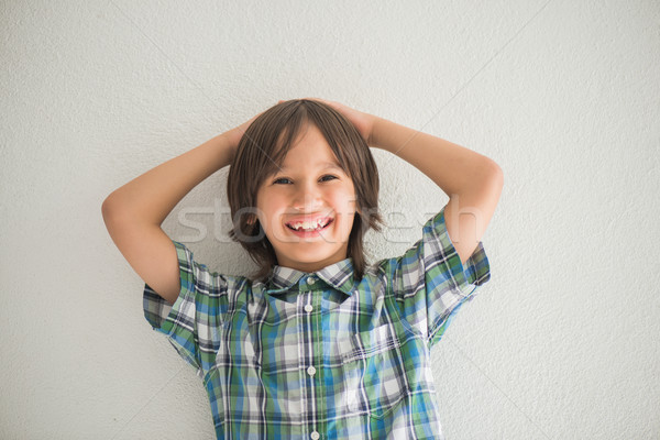 Smiling boy posing Stock photo © zurijeta