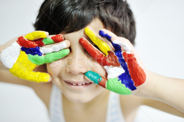 Little boy with hands painted in colorful paints ready for hand  Stock photo © zurijeta