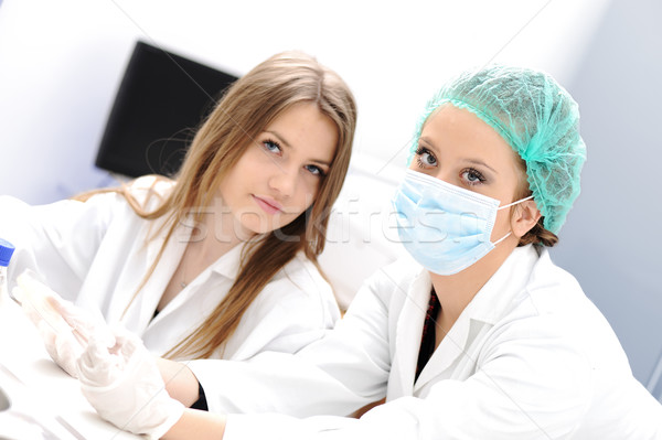 Stock photo: Inside the modern lab of university hospital, young confidental successful doctors and scientists