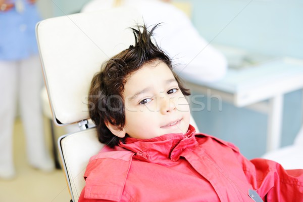 Kid visiting dentist office in hospital for pulling out milk too Stock photo © zurijeta