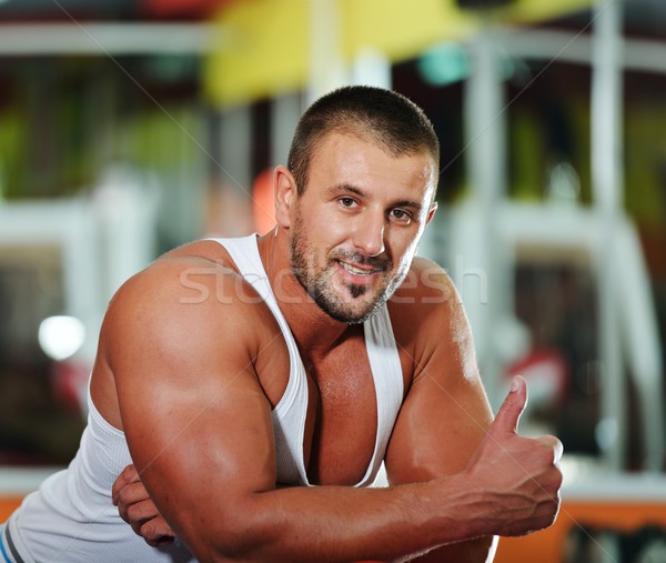 Athletic bodybuilder, execute exercise in sport gym hall Stock photo © zurijeta