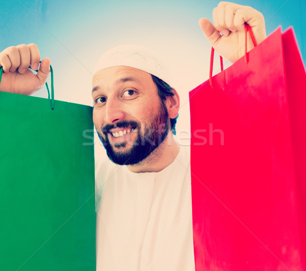 Arabic man with shopping bags smiling Stock photo © zurijeta