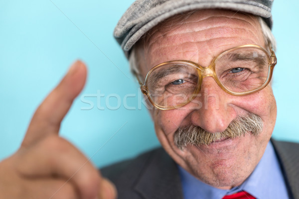 Portrait of a smiling and confident mature businessman with must Stock photo © zurijeta