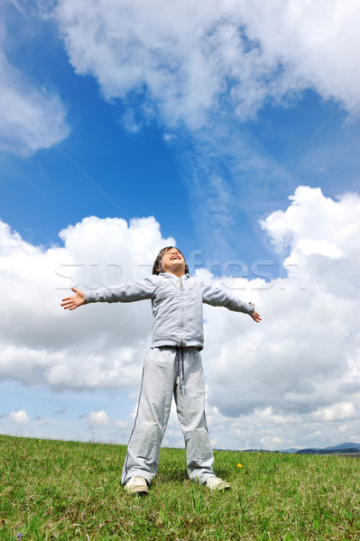 Stock photo: Little boy feeling a freedom on meadow in nature