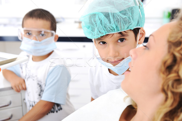 Child Dentist's teeth checkup, series of related photos Stock photo © zurijeta