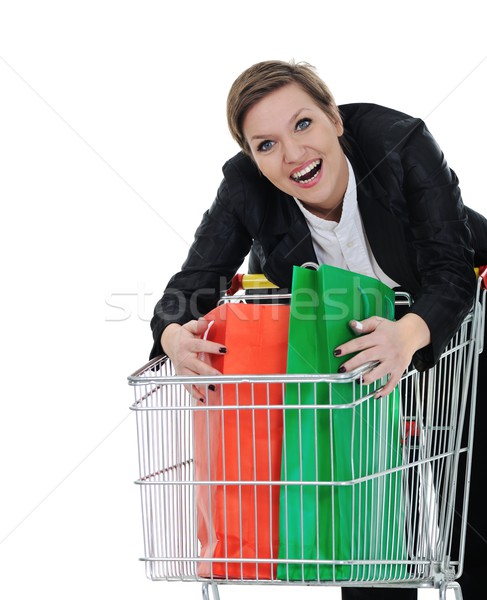 Young woman with shopping cart isolated Stock photo © zurijeta