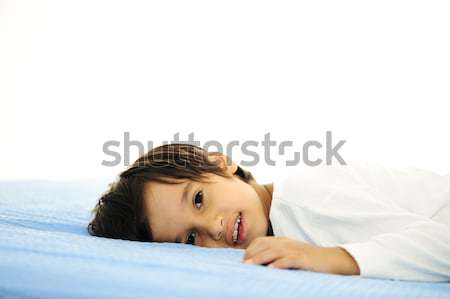 Kid on sleeping bed, happy bedtime in white bedroom Stock photo © zurijeta