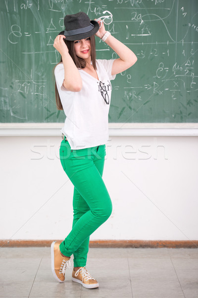 Schoolgirl with hat standing Stock photo © zurijeta