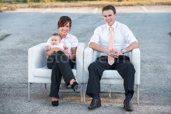 Smiling parents sitting in armchairs Stock photo © zurijeta