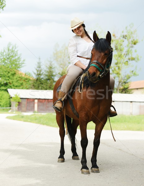 Immagine felice femminile seduta cavallo frazione Foto d'archivio © zurijeta