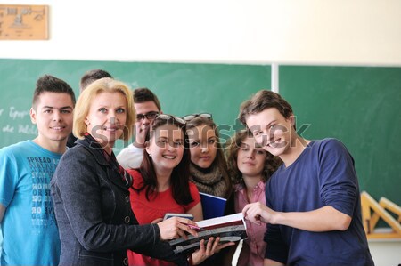 Stock photo: Teacher holding a copybook