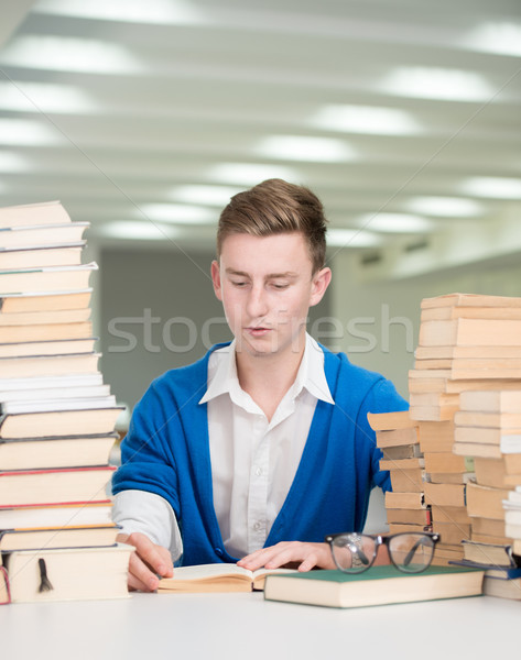 Stock photo: Young students studying and researching in college library with 