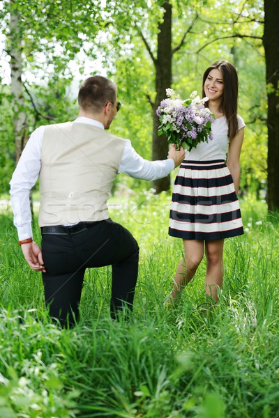 Portret romantische man bloemen verbergen Stockfoto © zurijeta