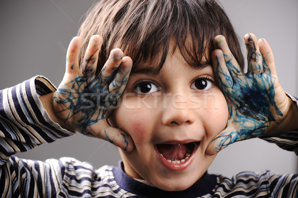 Excited little boy with messy color hands Stock photo © zurijeta