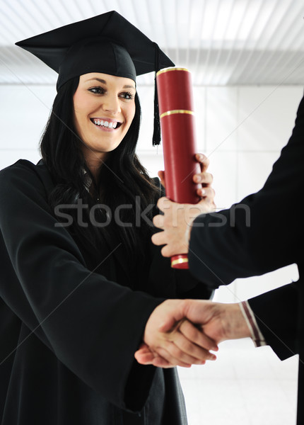 Young female graduating and receiving diploma at university Stock photo © zurijeta