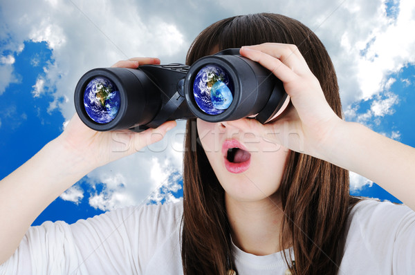 Stock photo: Girl with binoculars