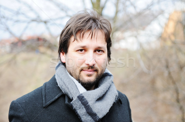Young man with winter coat Stock photo © zurijeta