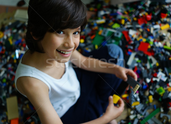 Child playing with construction blocks Stock photo © zurijeta