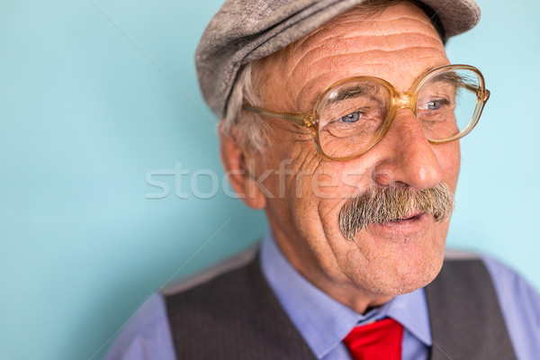 Portrait of a smiling and confident mature businessman with must Stock photo © zurijeta