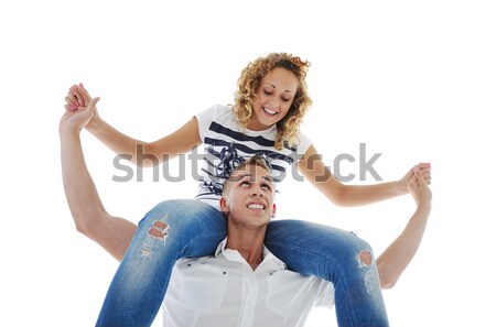 Portrait of handsome guy carrying his girlfriend  on shoulder against white background Stock photo © zurijeta