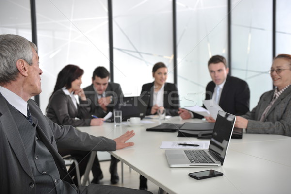 Senior male speaker giving a presentation at a business meeting at office Stock photo © zurijeta