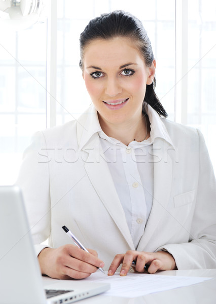 деловой женщины подписания документы служба лице ноутбука Сток-фото © zurijeta