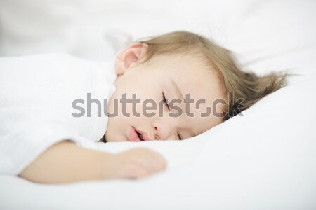 Baby sleeping on white bed with copy space Stock photo © zurijeta