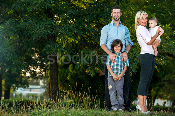 Happy family standing outside Stock photo © zurijeta