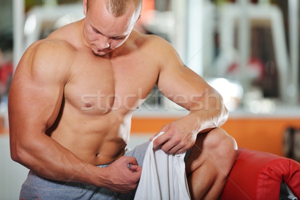 Athletic bodybuilder, execute exercise in sport gym hall Stock photo © zurijeta