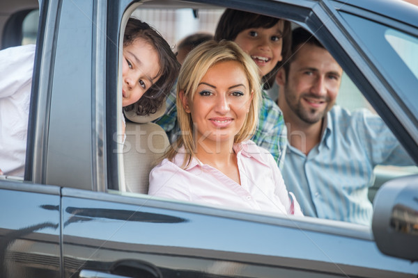 Happy family looking through car window Stock photo © zurijeta