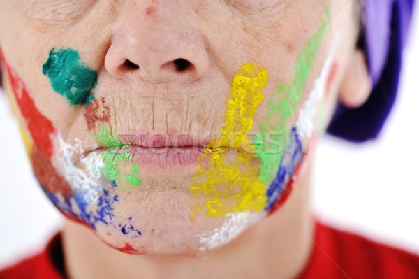 Elderly woman grandmother with painted face over white backgroun Stock photo © zurijeta