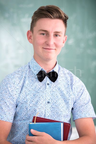 Happy school boy with textbooks Stock photo © zurijeta