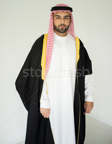 Portrait of attractive Arab man with sheikh robe Stock photo © zurijeta