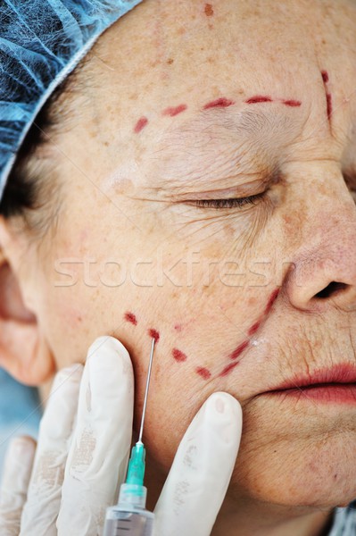 Elderly woman getting Botox injection procedure Stock photo © zurijeta