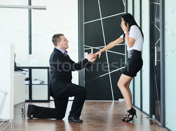 Young man romantically proposing to girlfriend and offering enga Stock photo © zurijeta