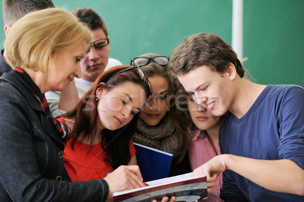 Students reading with a professor Stock photo © zurijeta