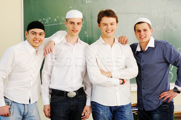 Casual group of students looking happy and smiling Stock photo © zurijeta