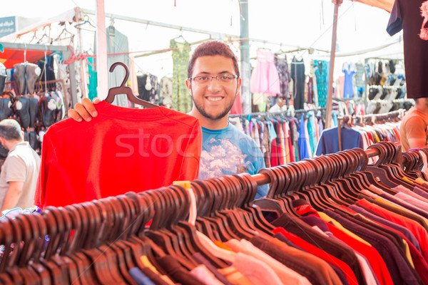Young man buying in second hand store Stock photo © zurijeta