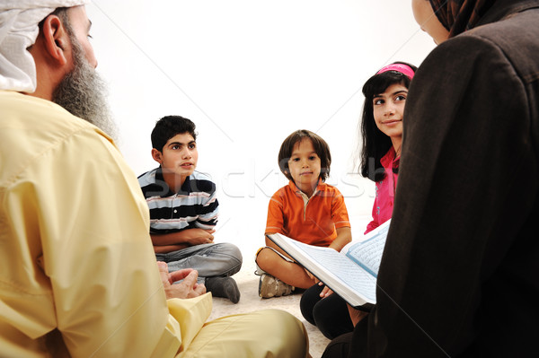 Education activity in Ramadan, Muslim couple and children reading Koran Stock photo © zurijeta